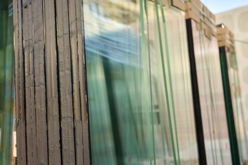 Transparent Glass Panels Artfully Stacked Together, Showcasing Unique Reflections