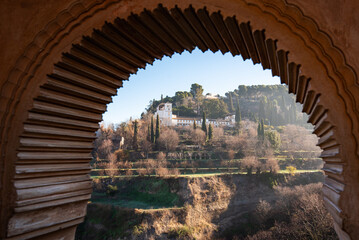 The Generalife and its orchard as seen from a window of the Partal Palace, The Alhambra, Granada.