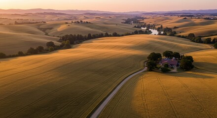 Fototapeta premium Tuscan Landscape Aerial View at Sunrise with Farmhouse and Winding Road