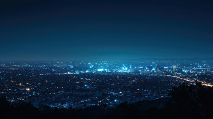 Fototapeta premium Nighttime Cityscape Stunning View of Los Angeles at Night Millions of Lights Gleaming Underneath the Dark Blue Sky Urban Landscape Aerial Photography