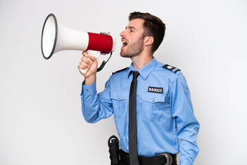 Young police caucasian man isolated on white background shouting through a megaphone