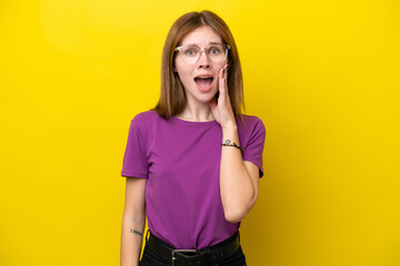Young English woman isolated on yellow background with surprise and shocked facial expression