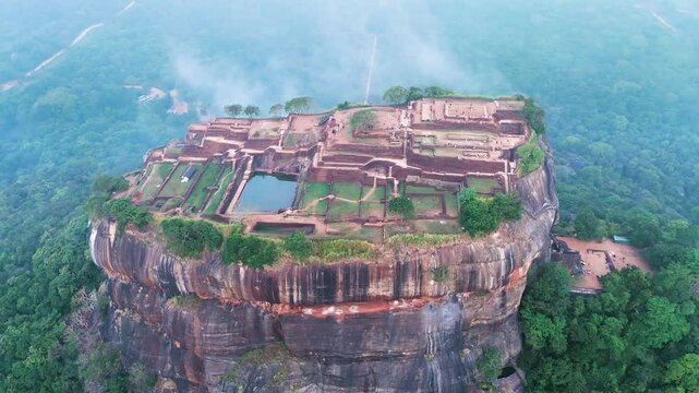 view of the famous ancient stone fortress Sigiriya (Lion Rock) on the island of Sri Lanka, which is a UNESCO World Heritage Site.
