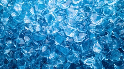 Closeup view of a frozen liquid surface with an abstract crystal like pattern in various shades of cool icy blue