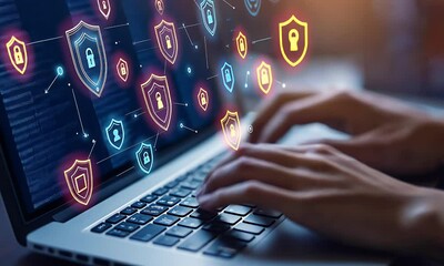 A person typing on a laptop with digital security icons representing cybersecurity concepts. - Powered by Adobe