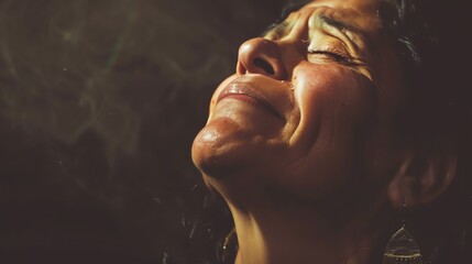 Close-up portrait of a beautiful woman with eyes closed and face upturned, enjoying the warm sunlight on her skin.