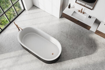 Modern bathroom interior with bathtub and sink on concrete floor. 3D Rendering