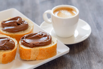 Bread with chocolate hazelnut spread. Sweet breakfast
