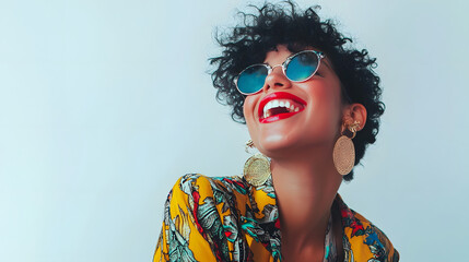Fototapeta premium Radiant and Cheerful Young Woman Exuding Confidence and Happiness while Wearing Fashionable Sunglasses in a Vibrant and Colorful Studio Setting