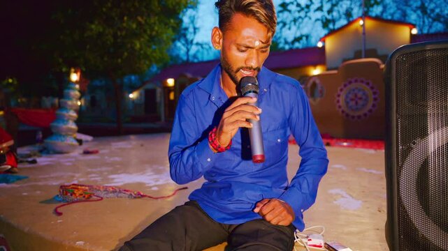 Singer performs outdoors in a rural setting