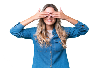 Young Uruguayan woman over isolated background covering eyes by hands and smiling