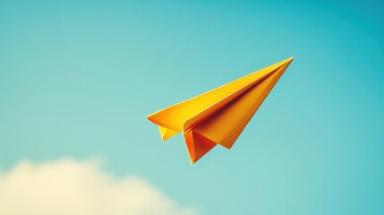 A vibrant yellow paper airplane mid-flight against a blue sky, capturing the essence of imagination, freedom, and playfulness