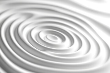 Obraz premium Swirling patterns on a smooth surface created by the gentle movement of liquid in a calm setting during daylight hours