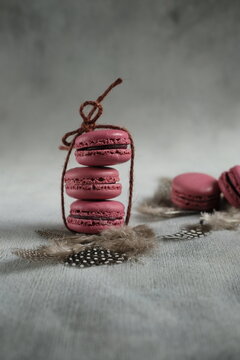Pink Macarones wrapped in ribbons.
