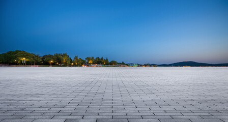 Fototapeta premium Tranquil Evening at a Spacious Paved Promenade by the Water