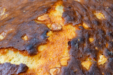 Close up of bake cake crust with nuts dessert