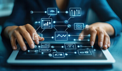Fototapeta premium Person using a tablet to manage and monitor a complex network of data and processes