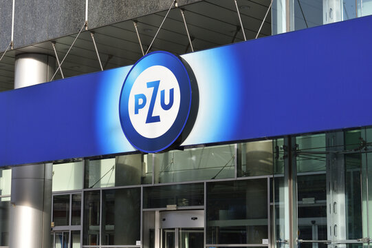 PZU insurance company office with emblem, logo, signage on the building facade. WARSAW, POLAND - FEBRUARY 12, 2023