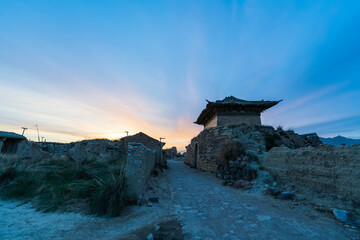Fototapeta premium The old house in rural China, Ancient Chinese castle, shabby old castle in China