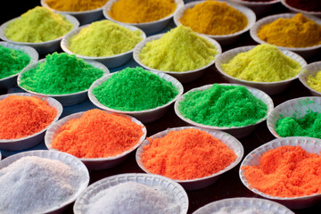 A close-up of various food colors used in baking and cooking.