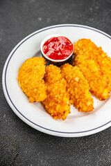 Nuggets chicken meat breaded deep fried fresh tasty food dish gourmet food background on the table rustic food top view copy space