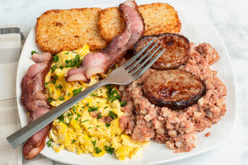 scramble eggs with  sausage patty and bacon