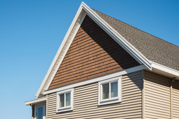 Facade of a house with nice windows. Real Estate Exterior Front House in a residential neighborhood.