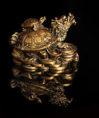 Chinese dragon turtle symbol of money on a black background