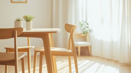 A modern wooden dining table and chairs, arranged in a bright, open-concept home space.