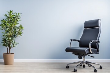 Modern black office chair next to a potted green plant against a light blue wall, symbolizing simplicity, comfort, and contemporary office design.


