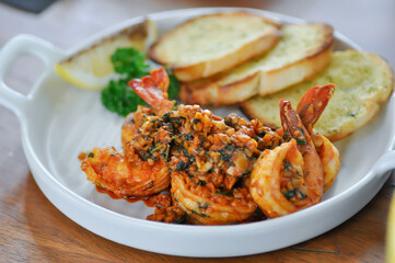 stir fried shrimp or Gambas al Ajillo or Shrimps pan fried with extravirgin olive oil and garlic with toast or bread