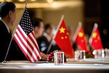 Group of people seated around a table with American and Chinese flags, symbolizing international cooperation or diplomatic meetings