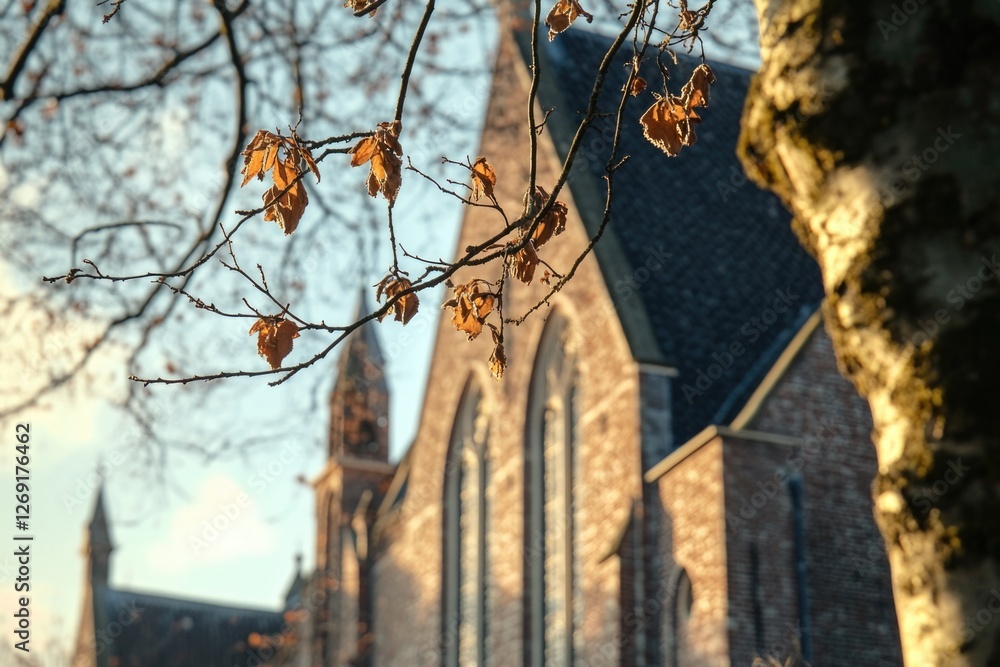 Poster a church building with a clock tower on its facade, suitable for use in various contexts such as arc