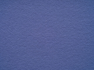 A textured haven of periwinkle blue felt, evoking the essence of artistic expression and quiet...
