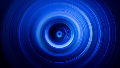 An abstract image of a swirling vortex of blue light, resembling a tunnel or a portal, against a dark background.