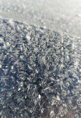 Frost close-up on metal in sunny weather