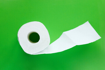 white toilet paper roll on green background