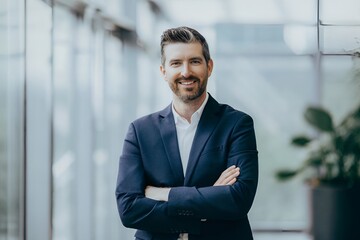 Confident Businessman in Modern Office with Stylish Attire and Professional Stance