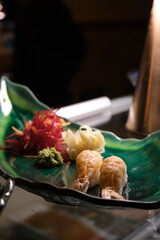 shrimp nigiri on a plate