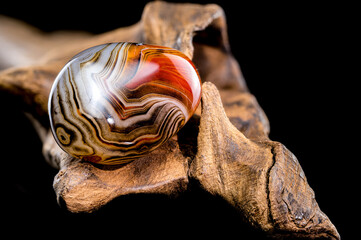 Colorful Agate Stone on Rough Wooden Surface