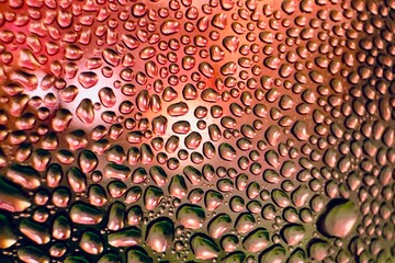 Close-up of water drops on metal surface in high resolution showing condensation of water droplets...