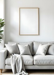 gray sofa with pillows and a blanket in a living room with a blank frame on the wall