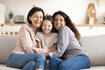 Most tight embraces ever. Portrait of happy multigenerational family older age granny young mommy...