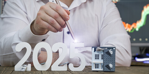 2025 Real Estate and Financial Growth Concept: Hand with Stylus Lighting Up Numbers and Model House...