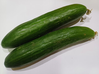 Cucumbers on white background, closeup, food photography