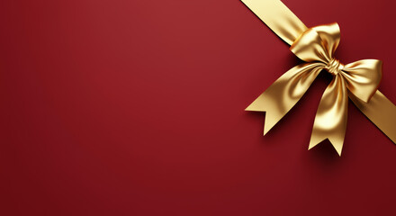 Elegant gold ribbon bow on rich red background for festive moments of birthday or New Year celebrations