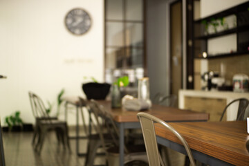 Blur concept of dining table with tissue box and modern kitchen background neatly arranged