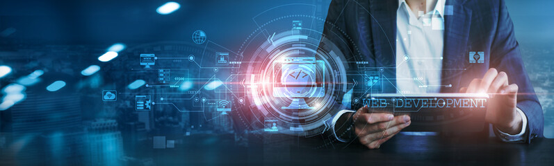 Businessman using a tablet to analyze website performance, user experience, traffic metrics, conversion rates, SEO rankings, code functionality, market trends, analytics data, development frameworks.