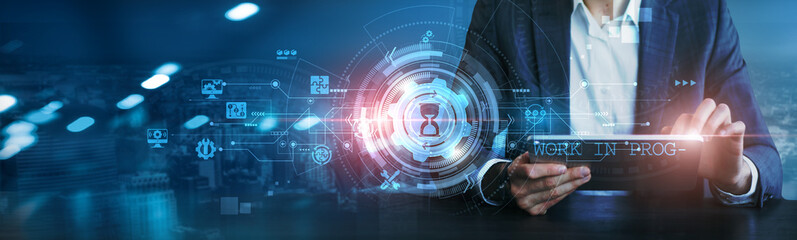 Work In Progress. Businessman using tablet analyzing financial data, market trends, sales performance, customer feedback, and operational efficiency.