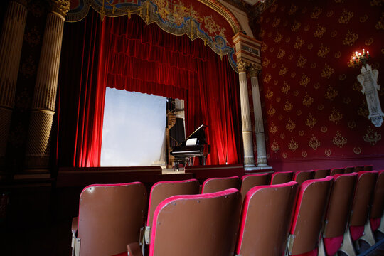 Elegant empty theater interior with velvet seats and old decor